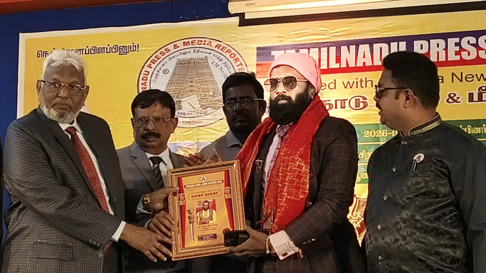 Dr. John Yesudhas Receiving Award